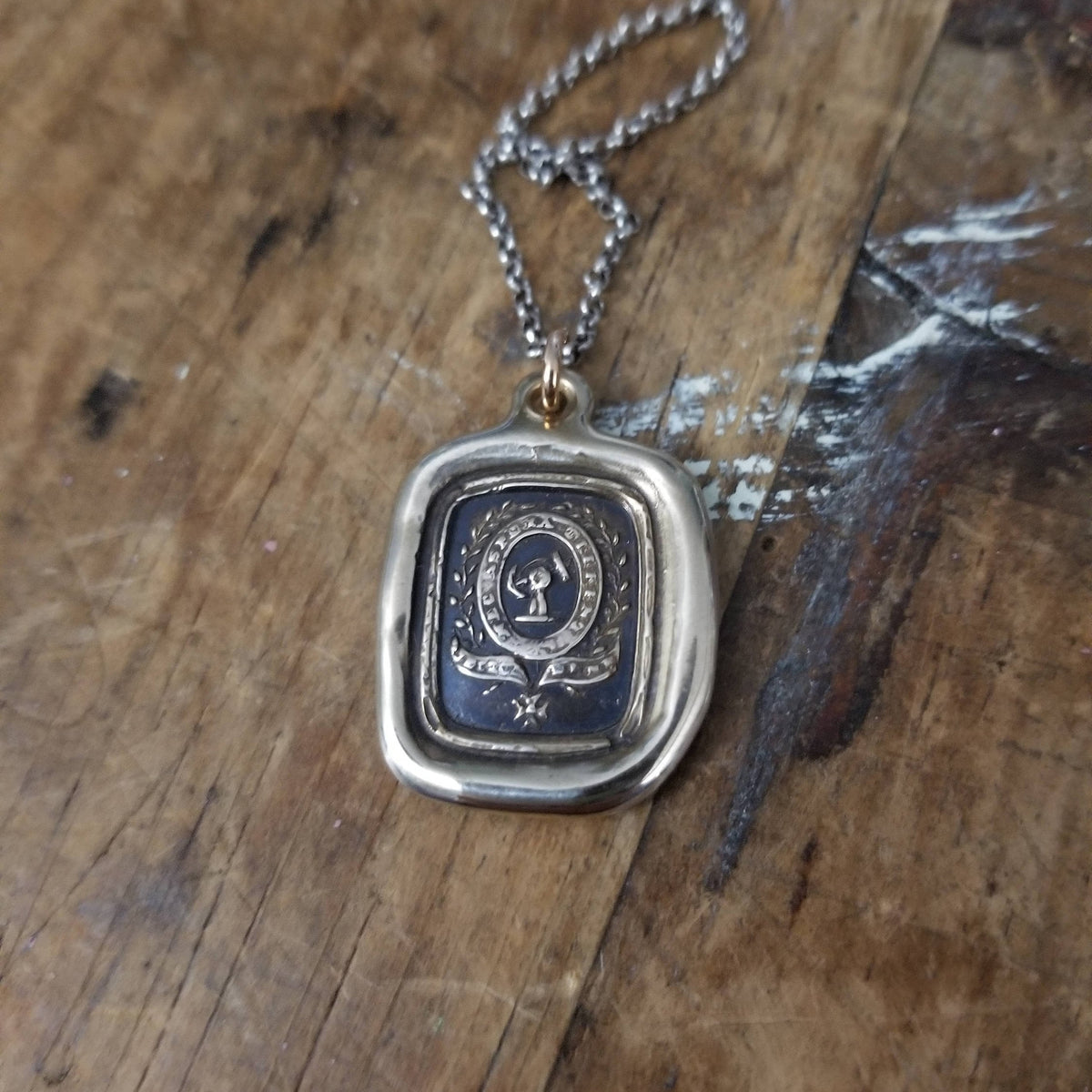 Fist anf Anchor - Courage and Challenge in bronze