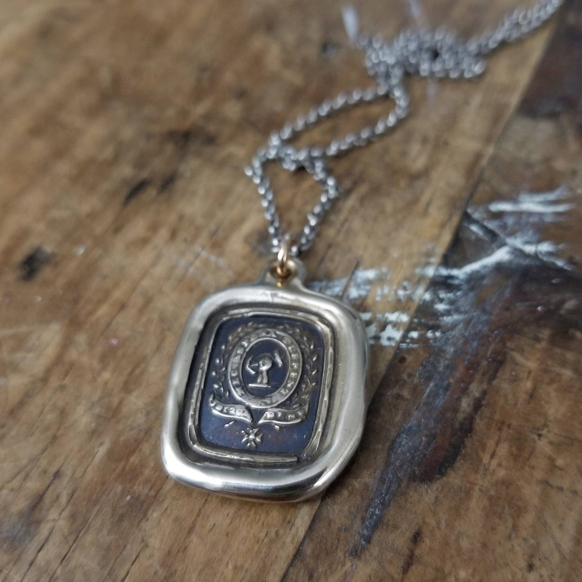 Fist anf Anchor - Courage and Challenge in bronze