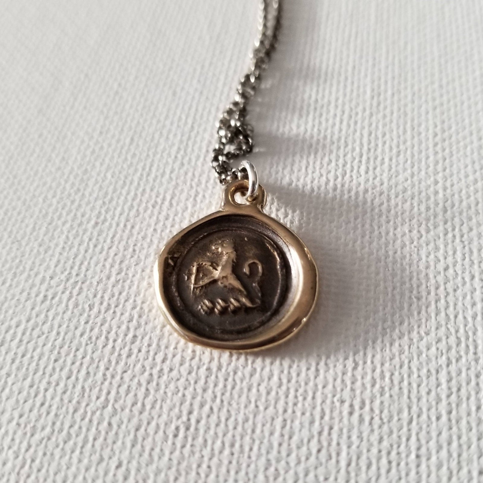 Lion Crosslet Fitchee in bronze