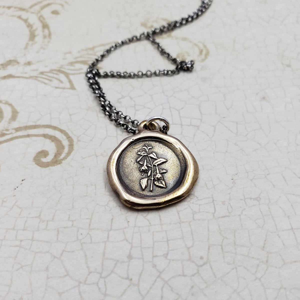 Fuchsia flower necklace in bronze