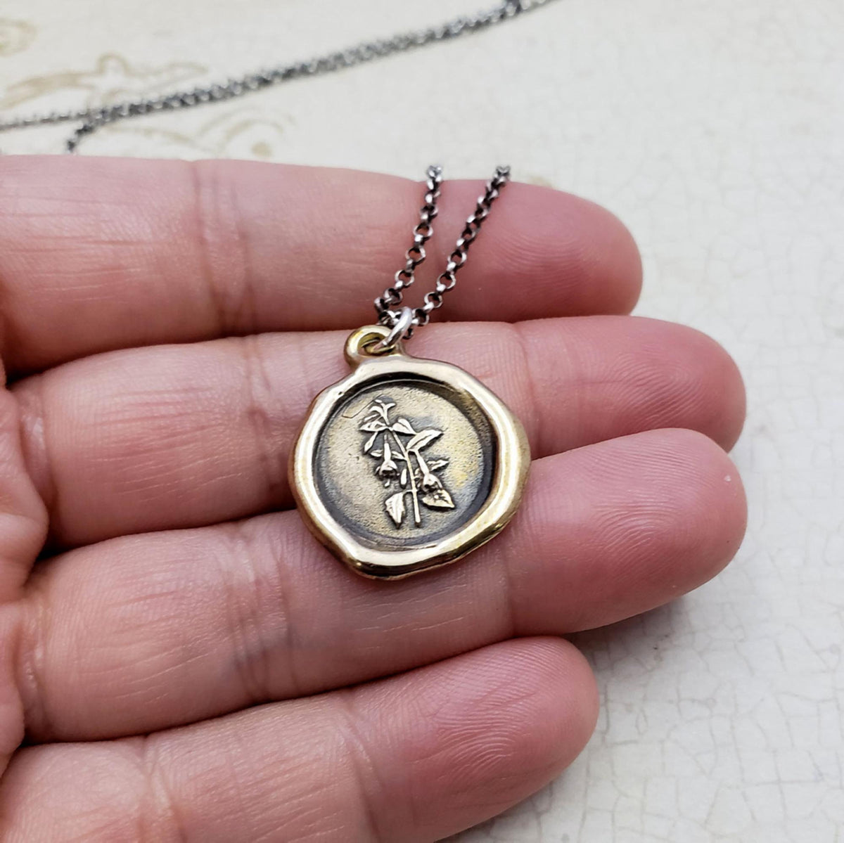 Fuchsia flower necklace in bronze