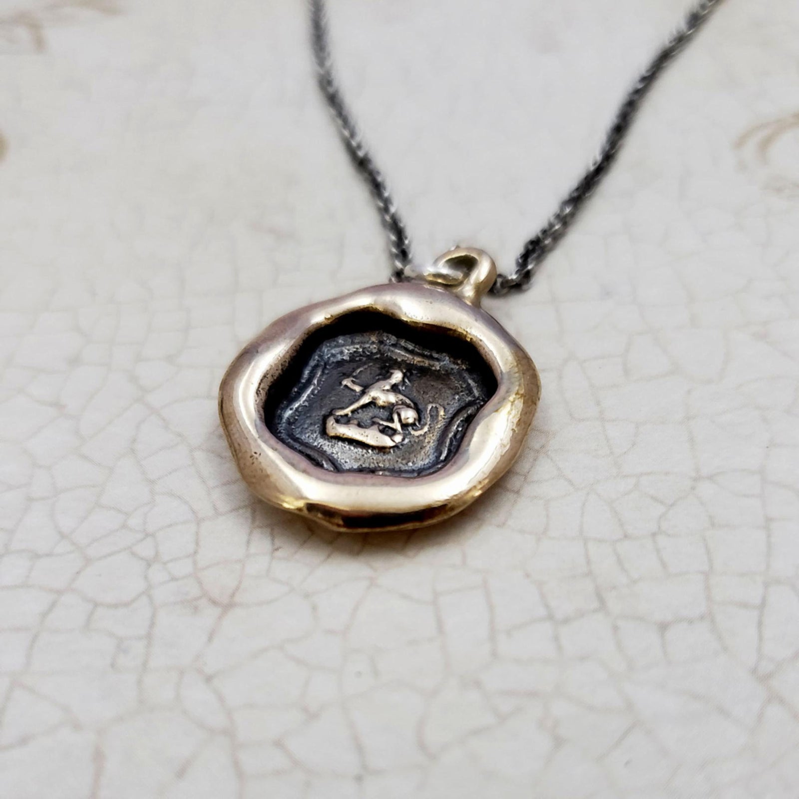 Dog and Sword Protection Necklace in bronze