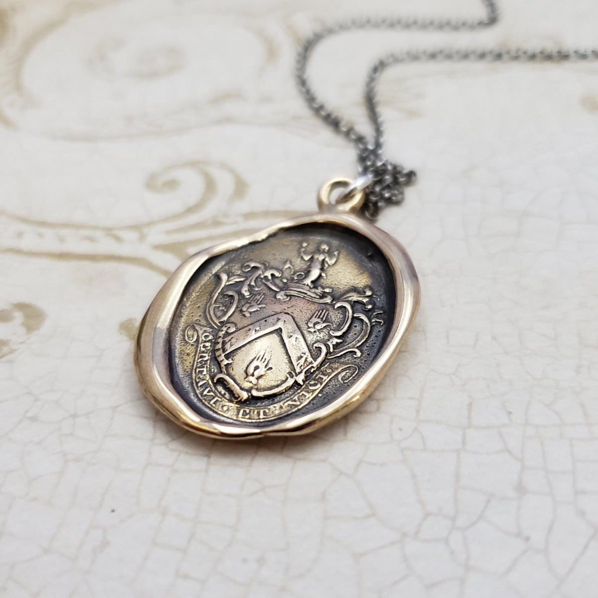 Mermaid - &#39;I have fought and conquered&#39; in bronze