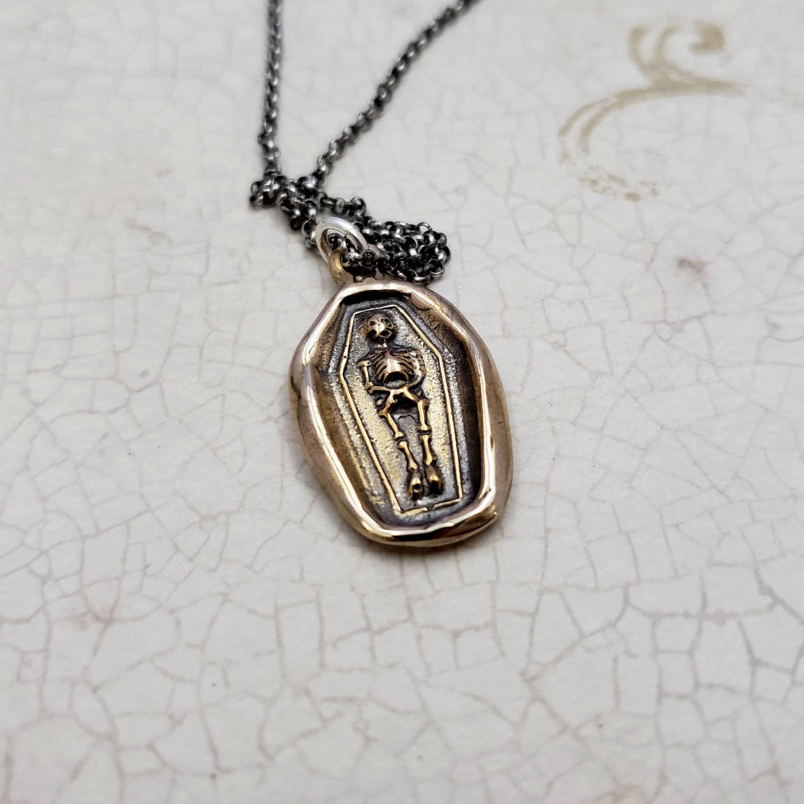 Skeleton Wax Seal Necklace in Bronze