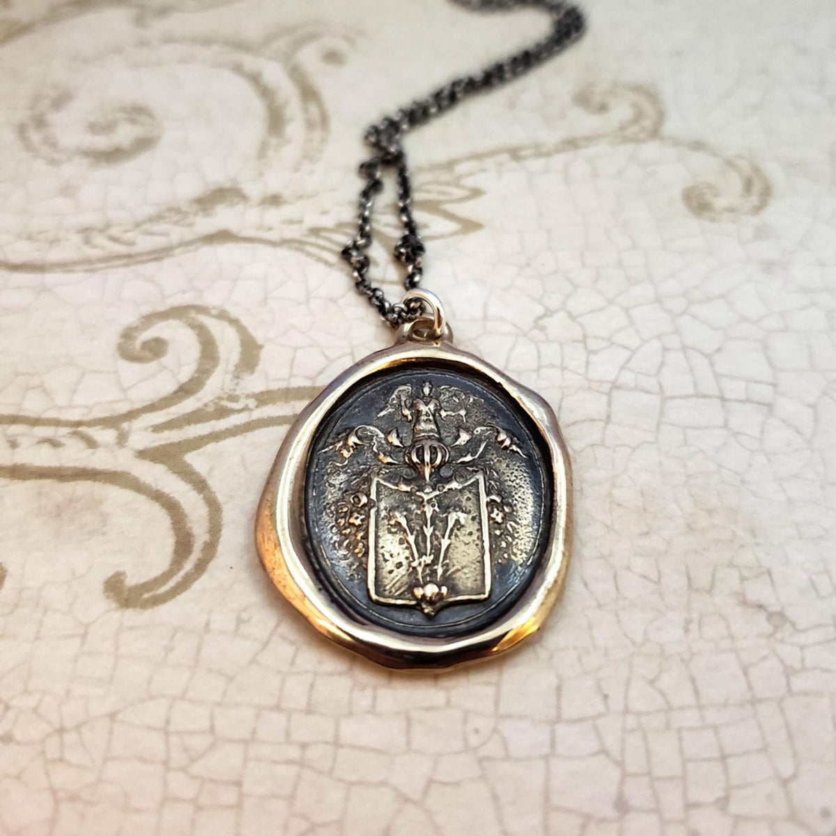 Angel and Fleur De Lis Crest in Bronze