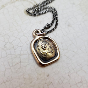 Skull and Crossbones - I do not fear your heart necklace in Bronze