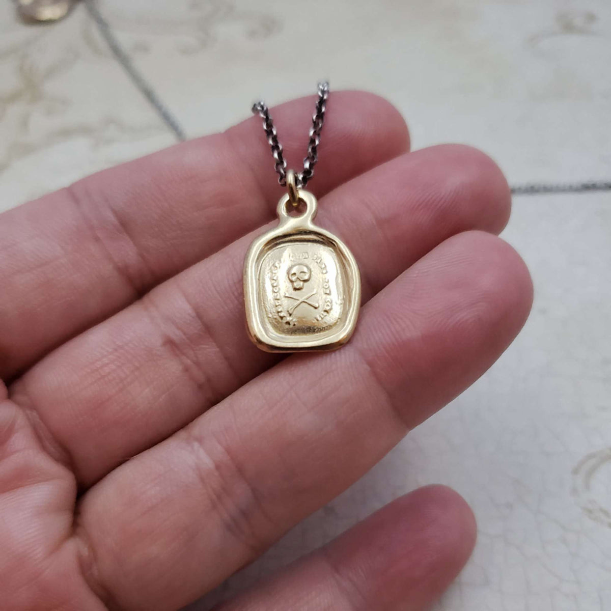 Skull &amp; Crossbones &#39;I do not fear your heart&#39; necklace in Gold Vermeil