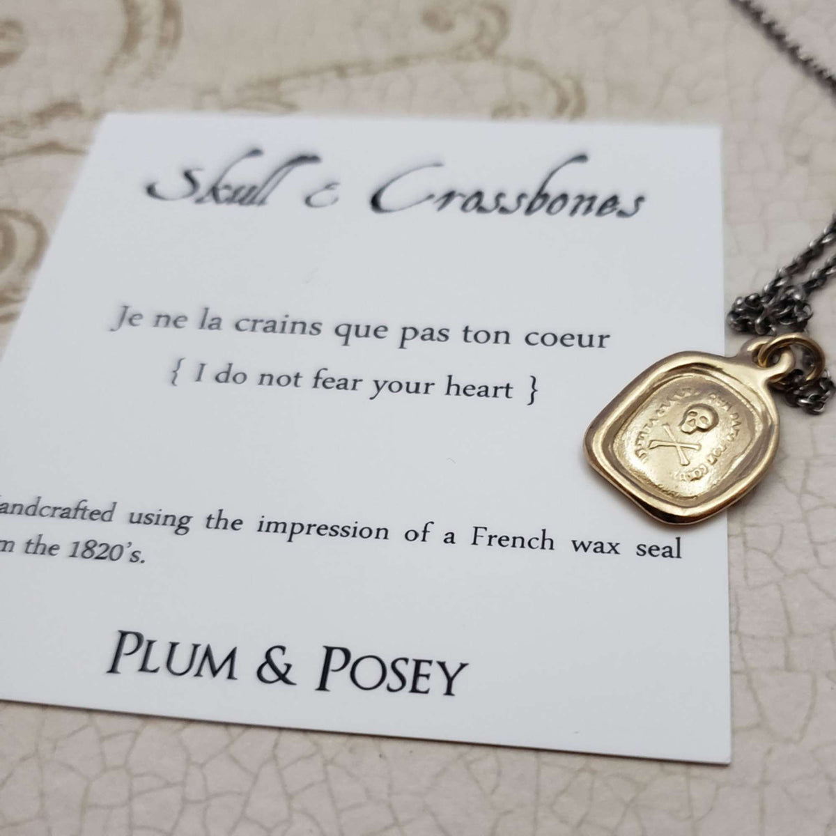 Skull &amp; Crossbones &#39;I do not fear your heart&#39; necklace in Gold Vermeil