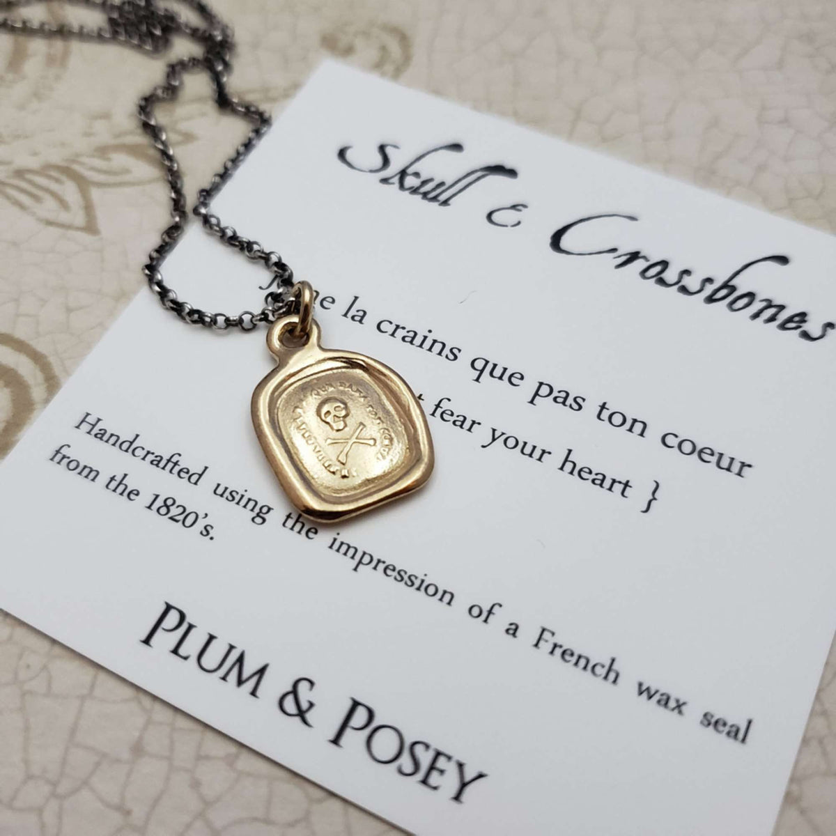 Skull &amp; Crossbones 'I do not fear your heart' necklace in Gold Vermeil