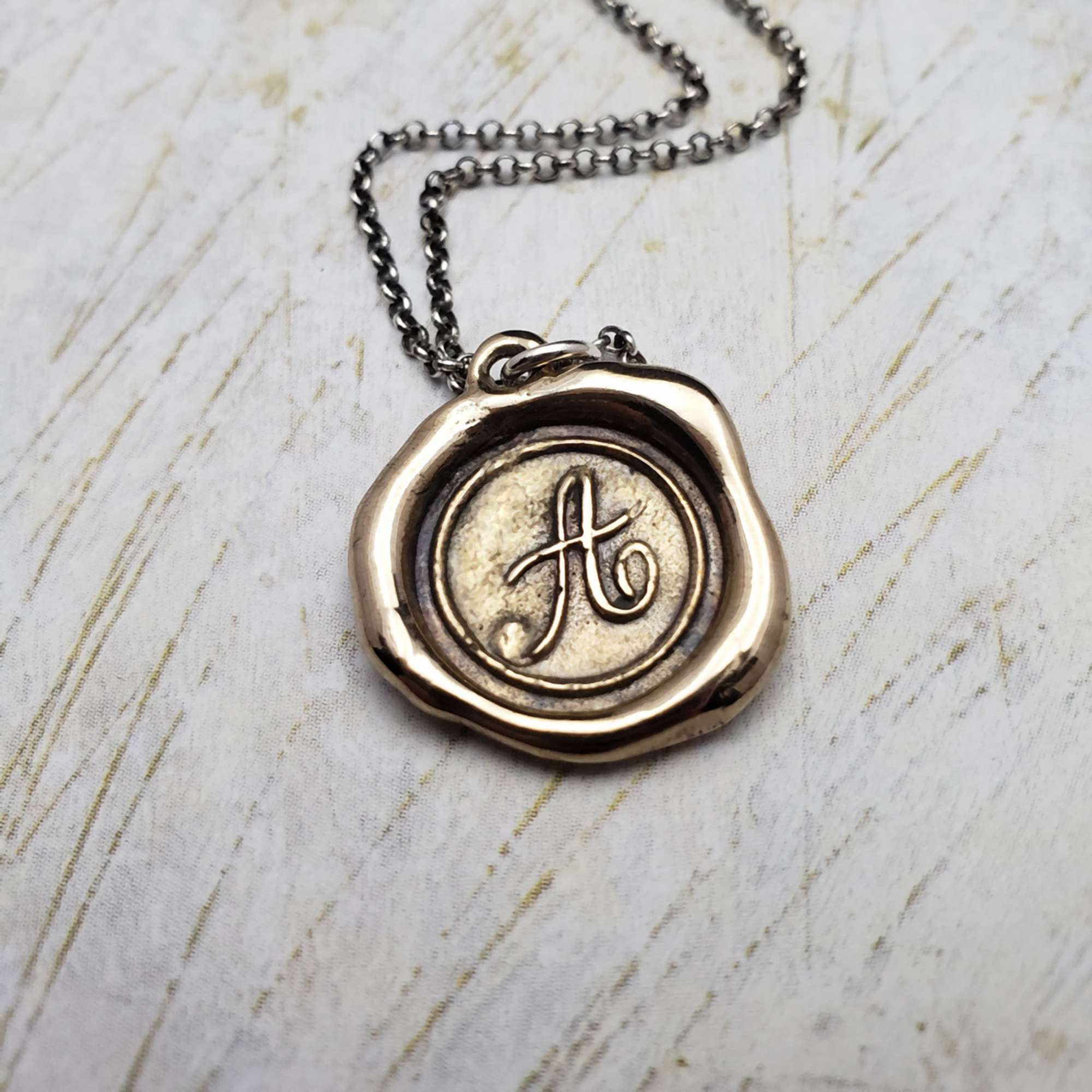 Initial A in Bronze