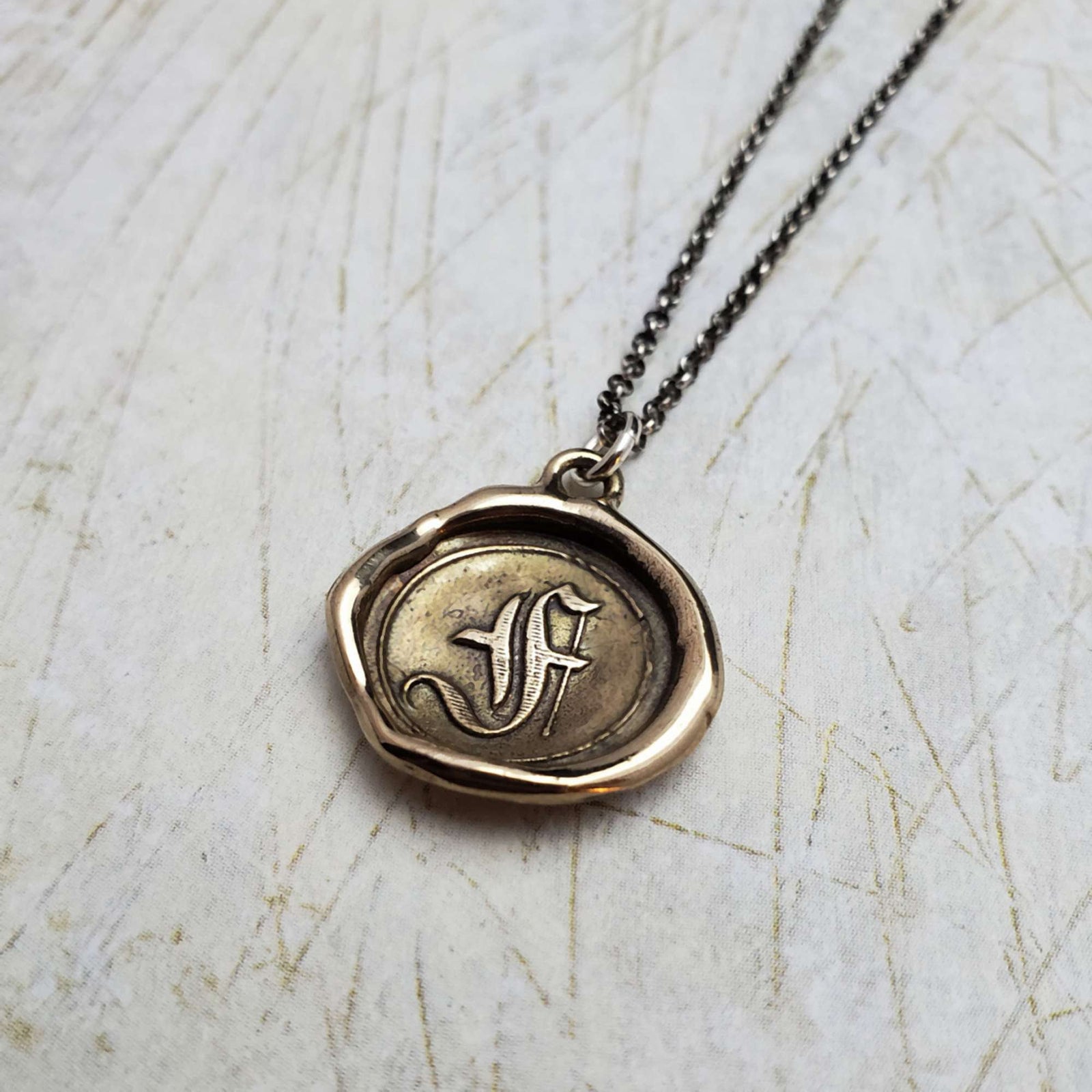 Initial F in Bronze
