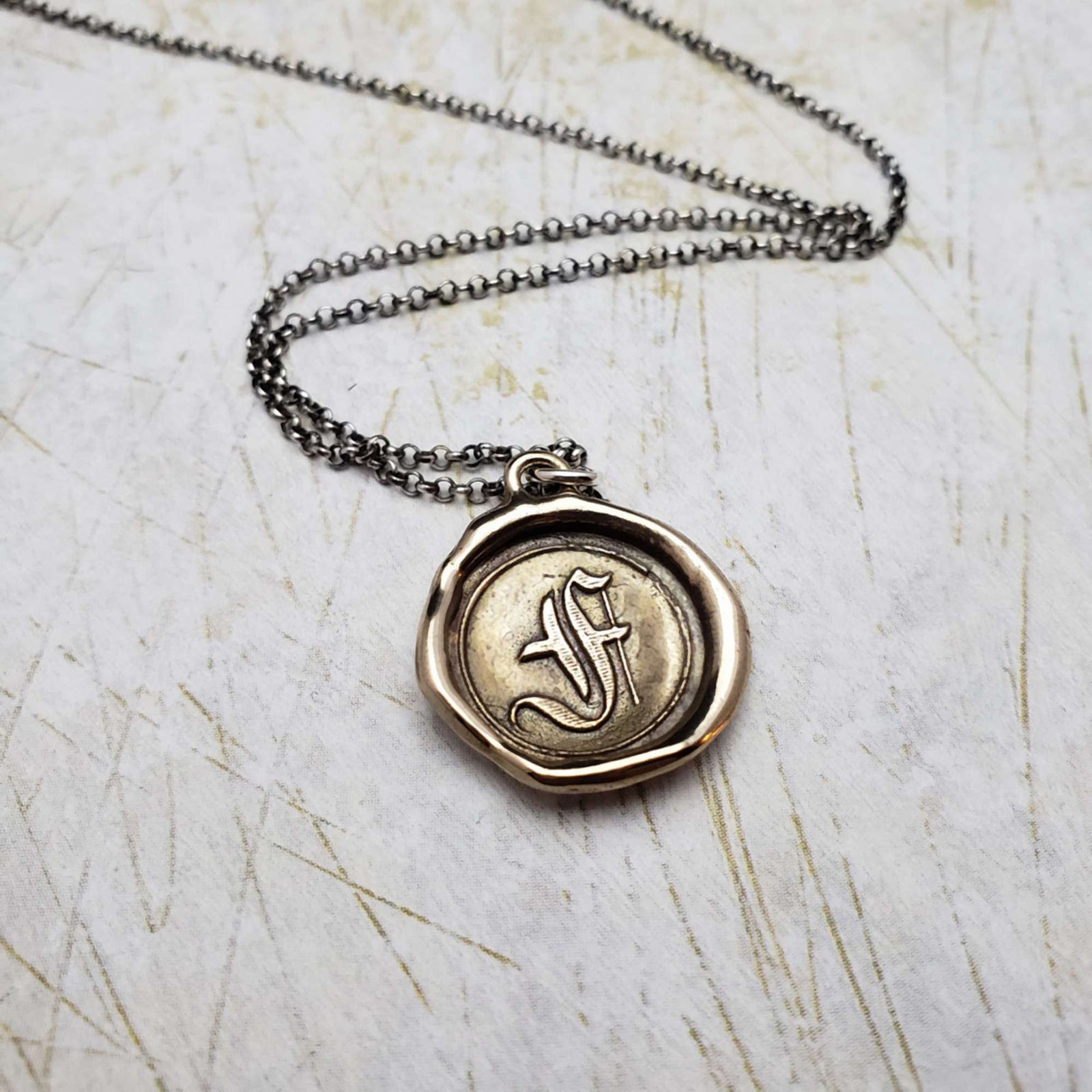 Initial F in Bronze