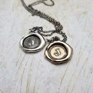 Initial J in Bronze