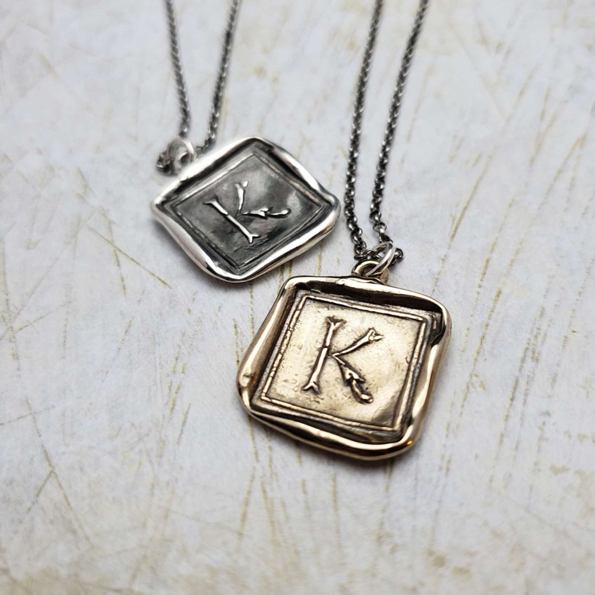 Initial K in Bronze