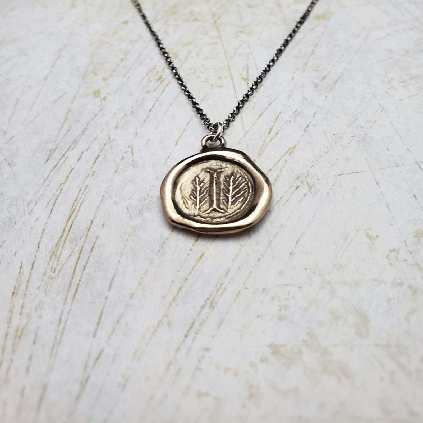 Initial I in Bronze