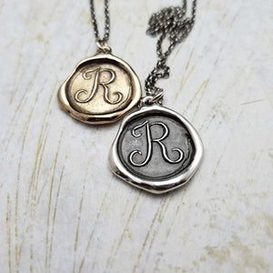 Initial R in Bronze