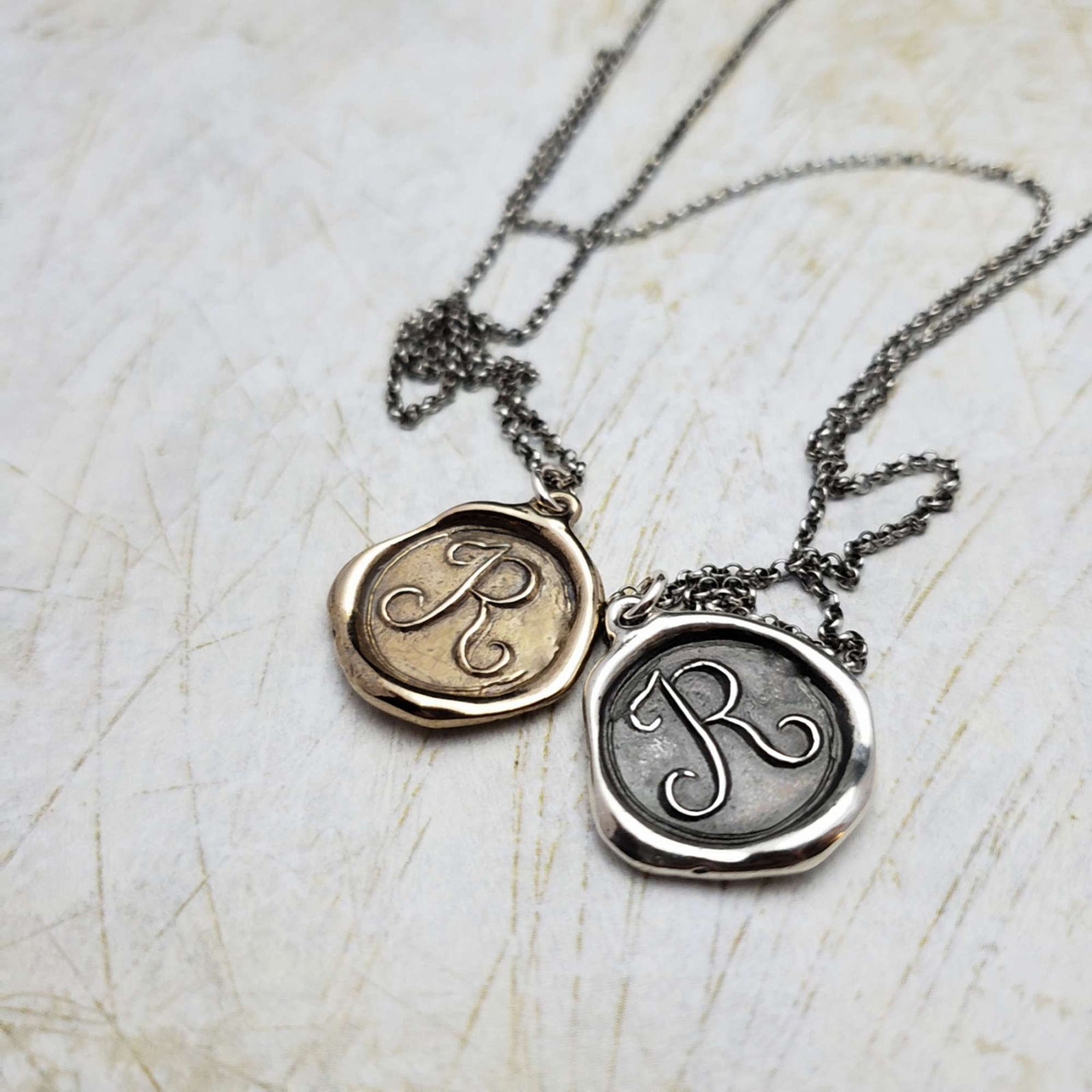 Initial R in Bronze