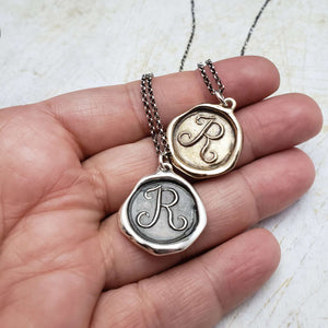 Initial R in Bronze