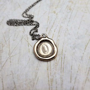 Initial O in Bronze