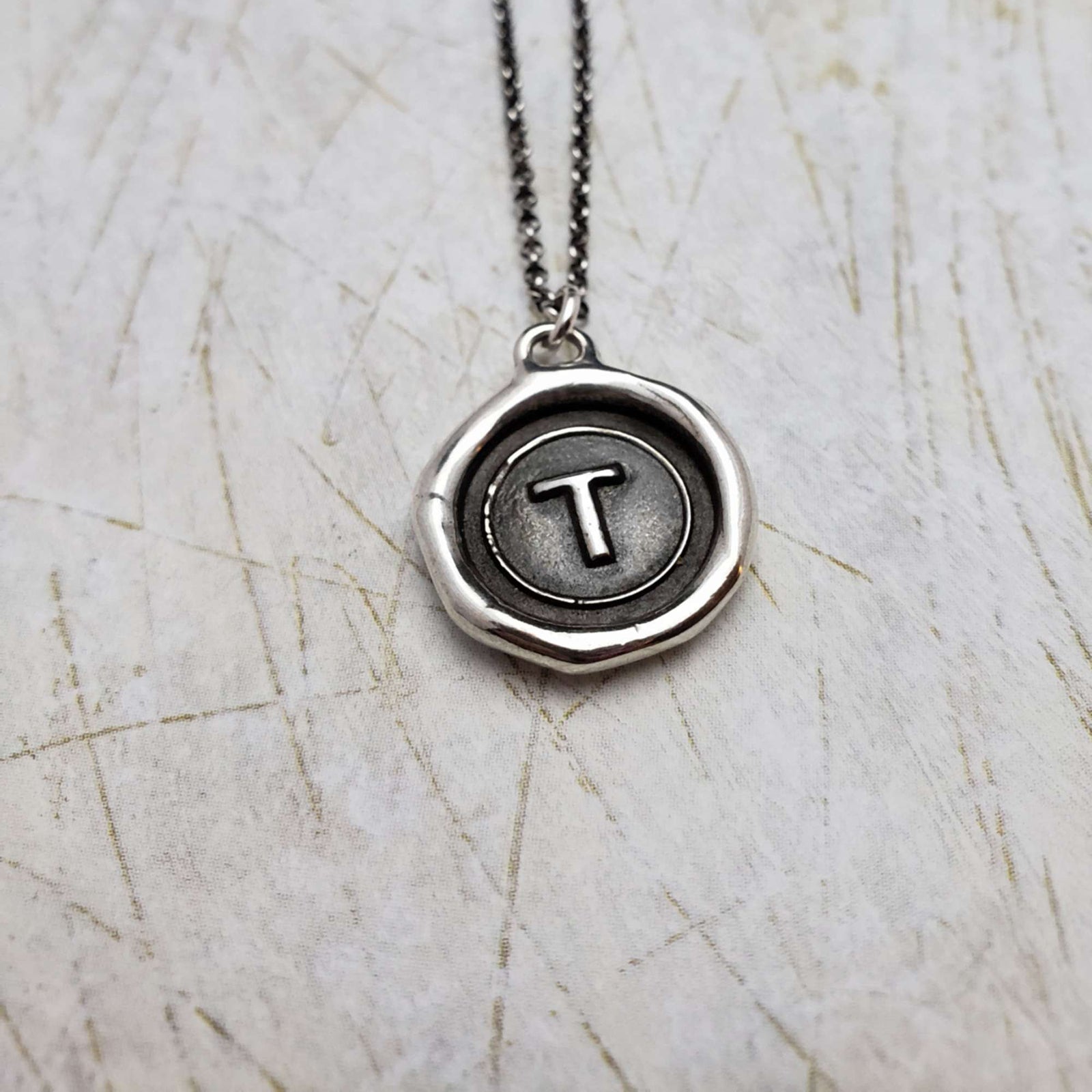 Initial T