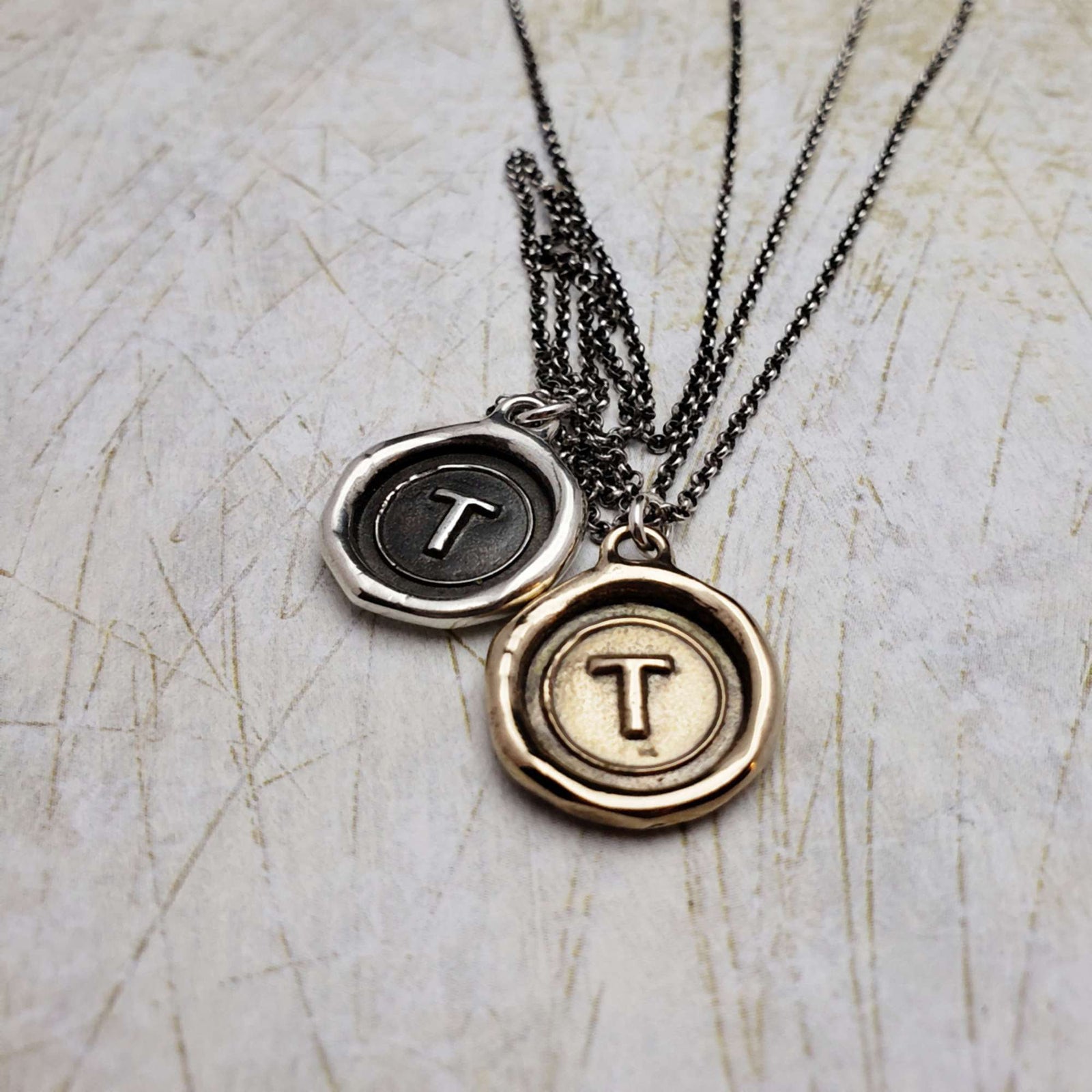 Initial T in Bronze