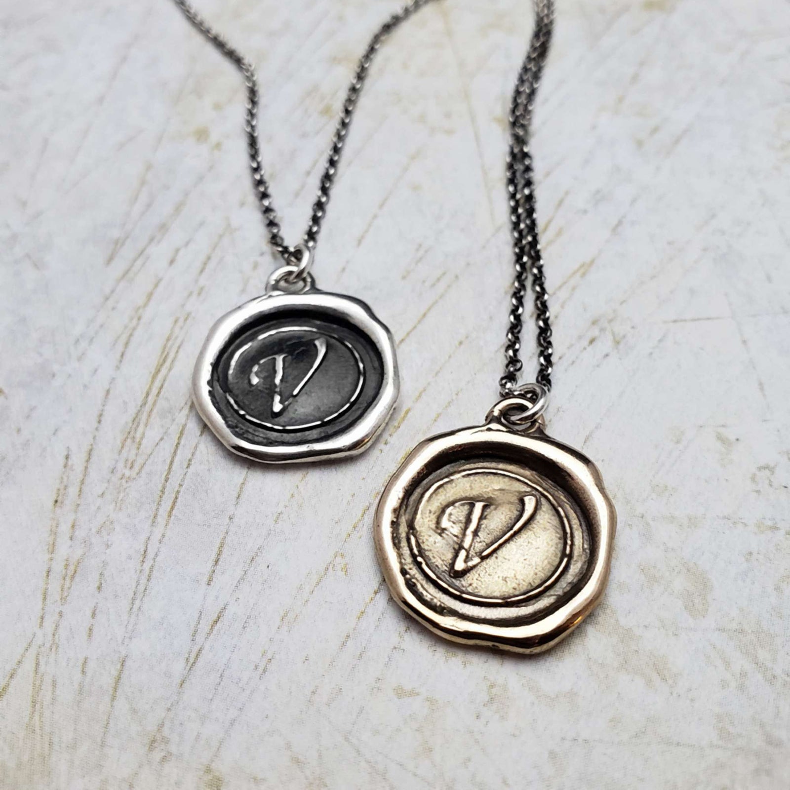 Initial V in Bronze