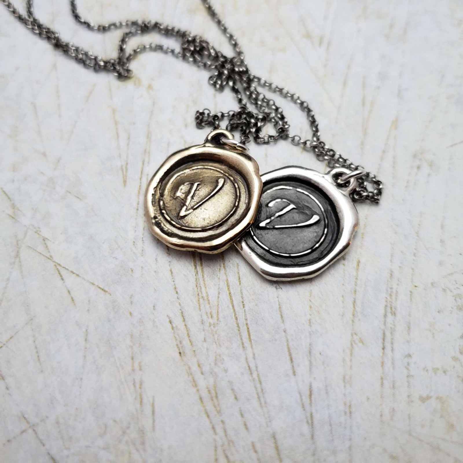 Initial V in Bronze