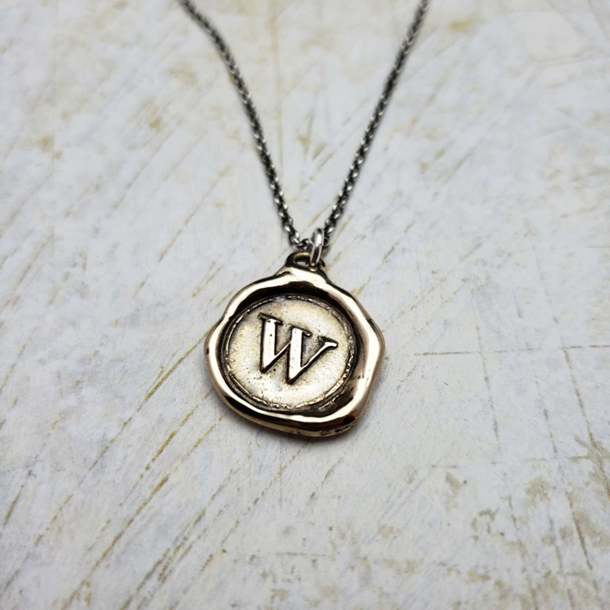 Initial W in Bronze