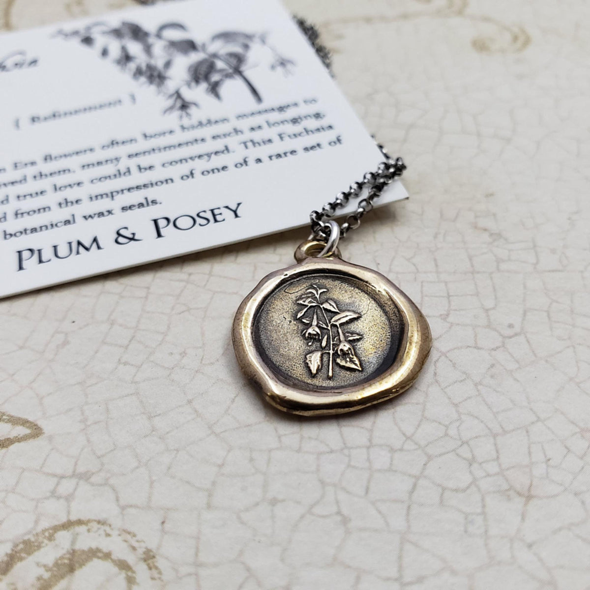 Fuchsia flower necklace in bronze