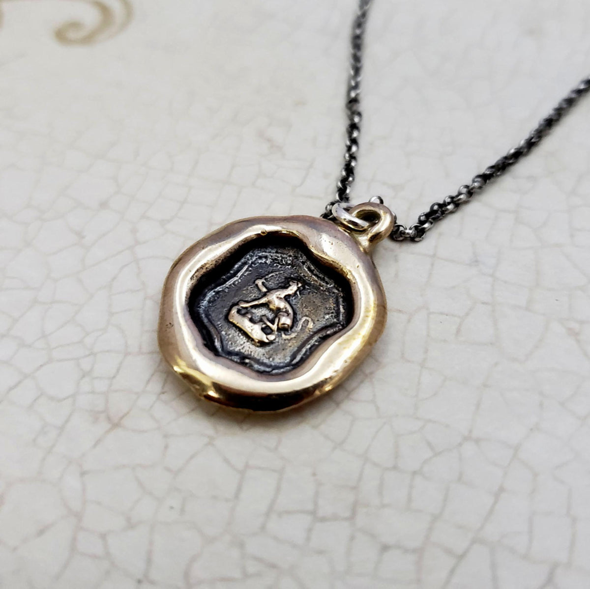 Dog and Sword Protection Necklace in bronze