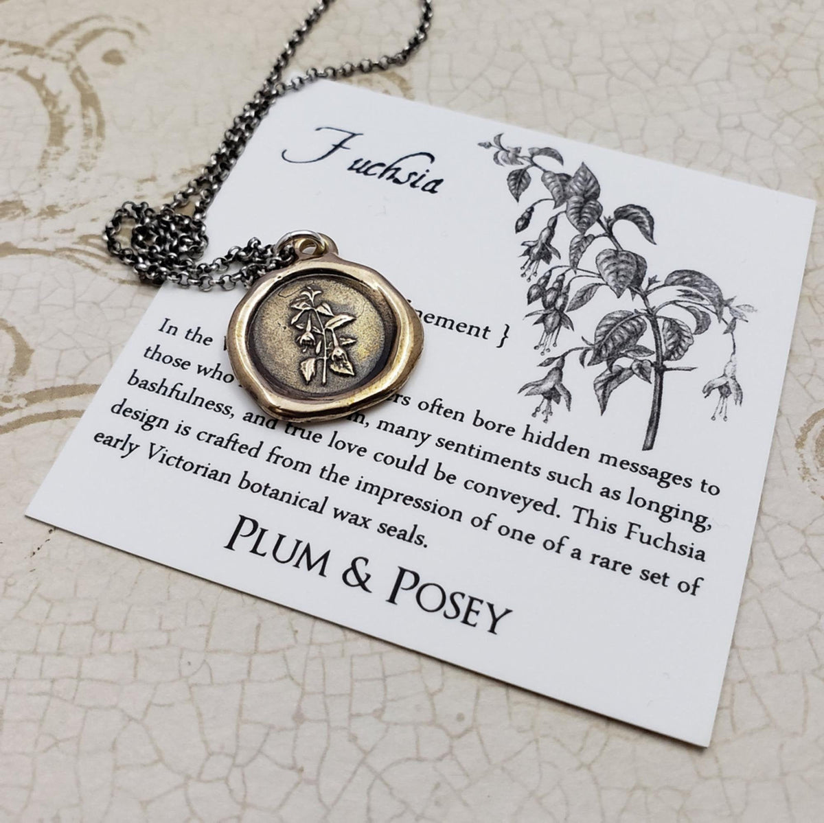 Fuchsia flower necklace in bronze