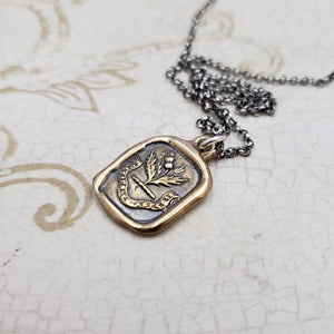 Sweeter after difficulties Thistle necklace in Bronze