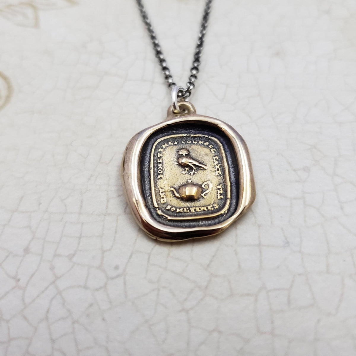 Council and Comfort, Owl and Teapot wax seal pendant in Bronze