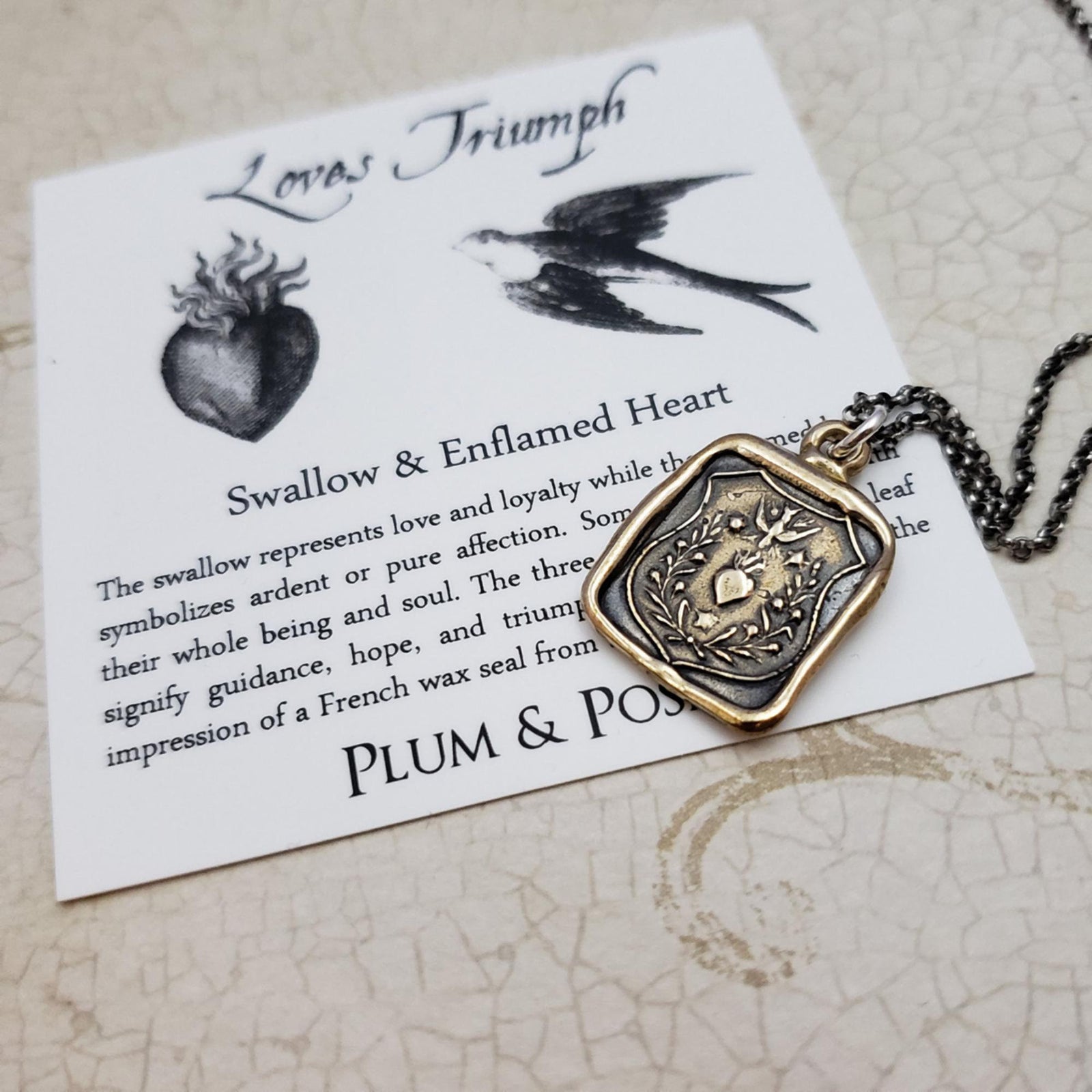 Swallow and Enflamed Heart Necklace in Bronze