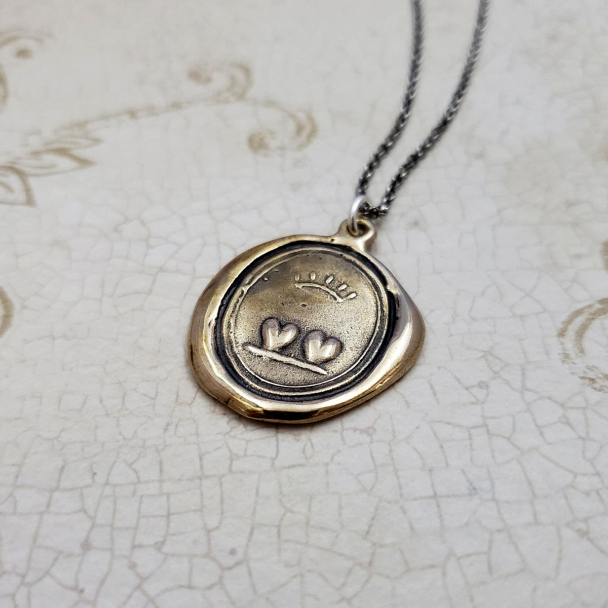 Loyalty and Love Crowned Hearts Wax Seal Necklace in Bronze