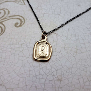 Skull & Crossbones 'I do not fear your heart' necklace in Gold Vermeil