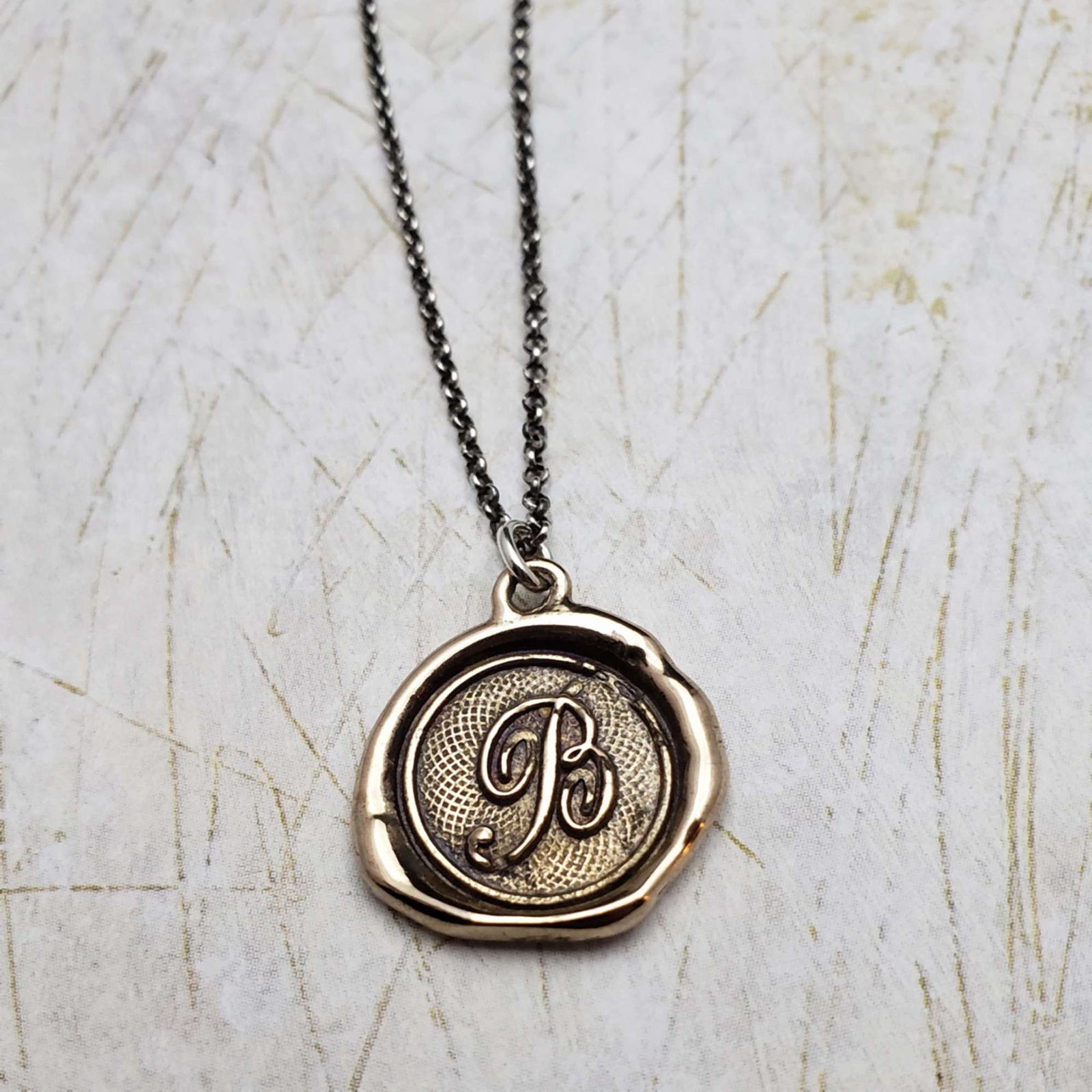 Initial B in Bronze