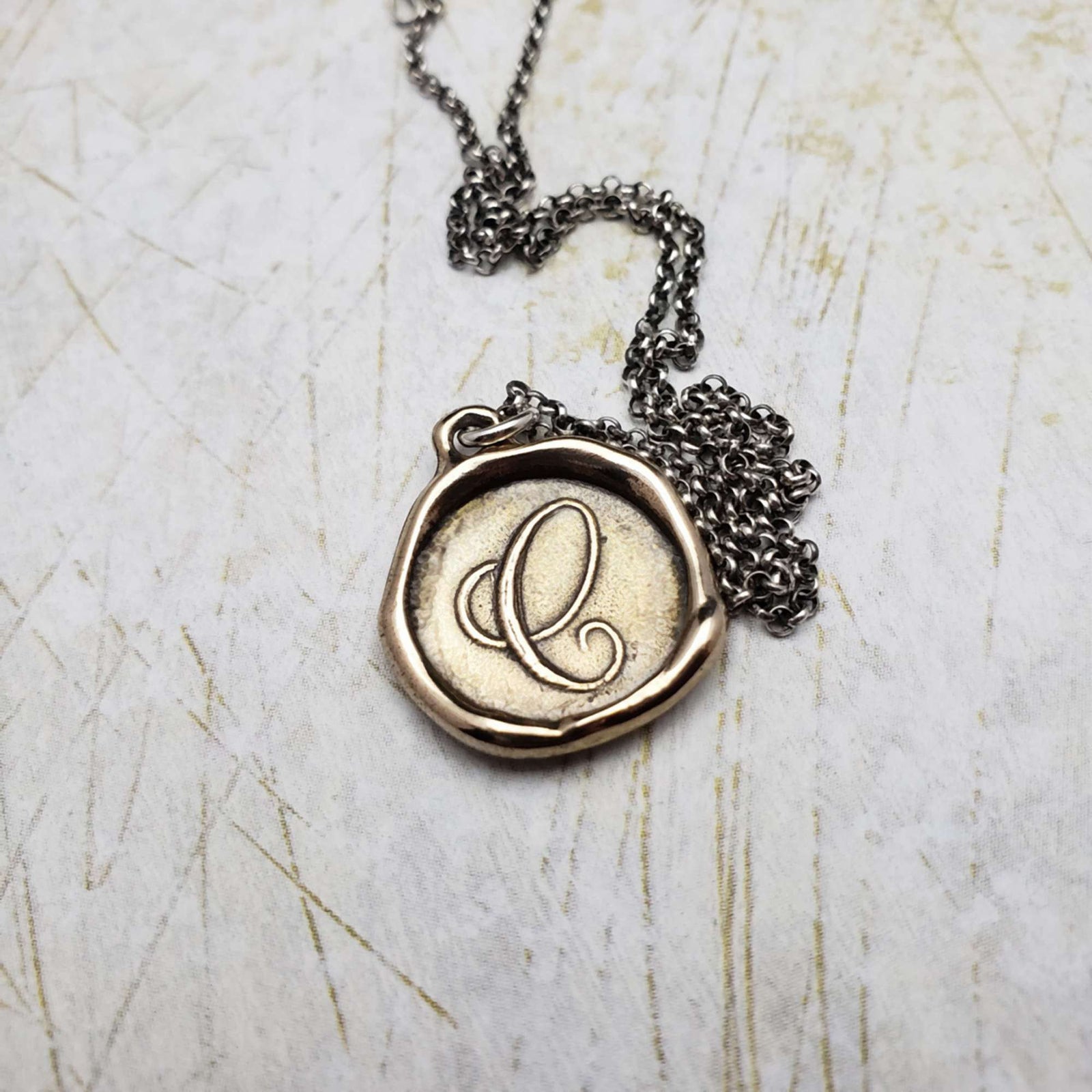 Initial C in Bronze