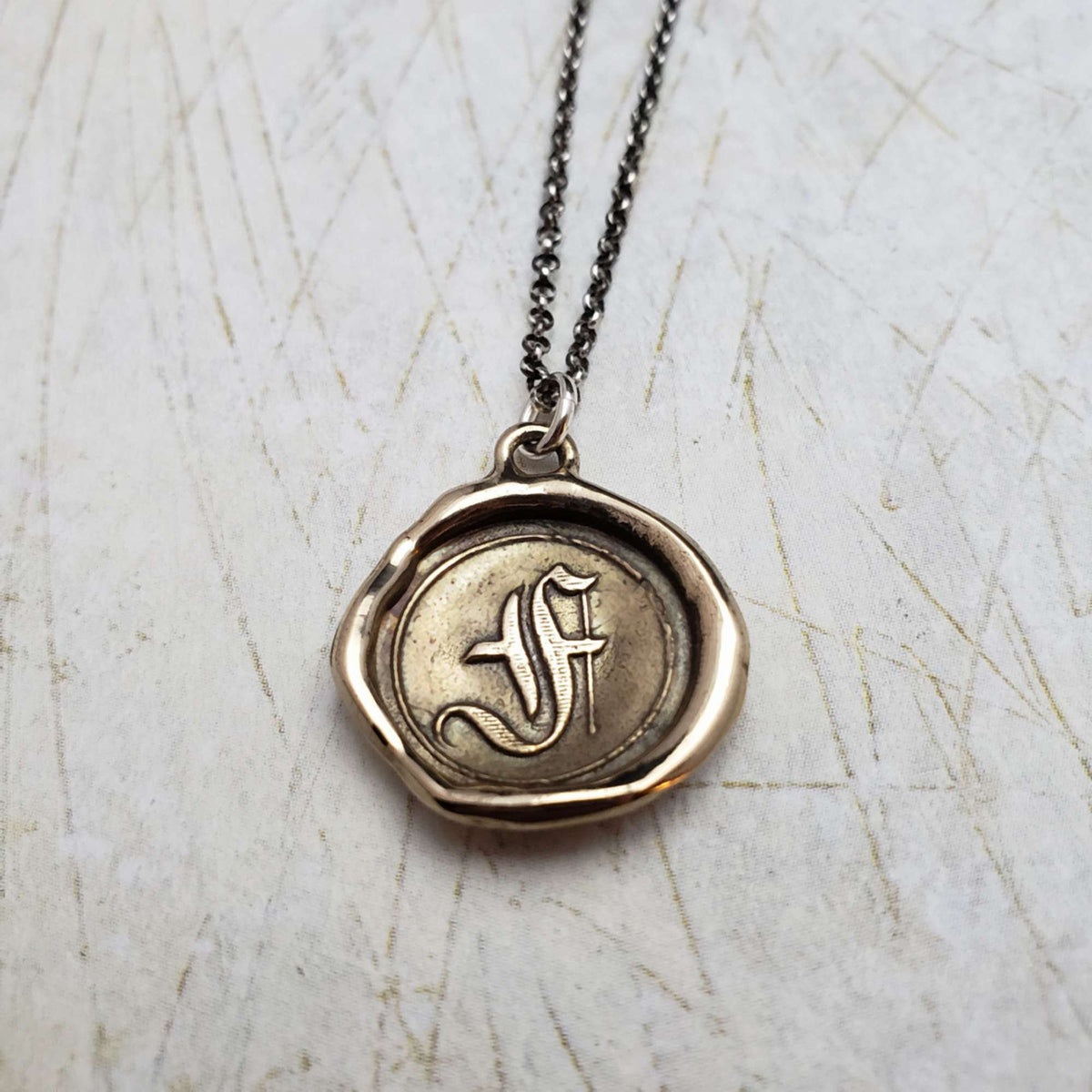 Initial F in Bronze