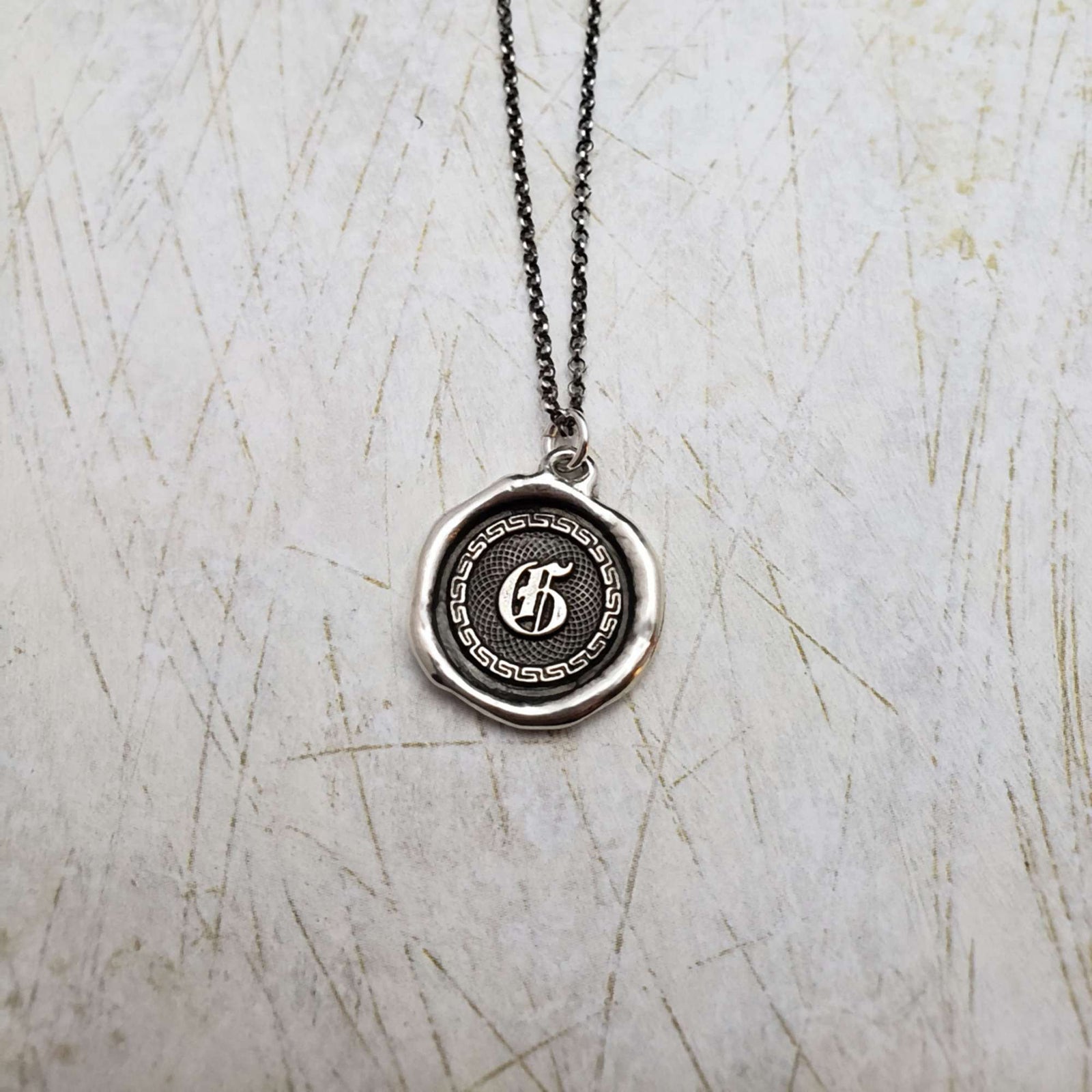 Initial G