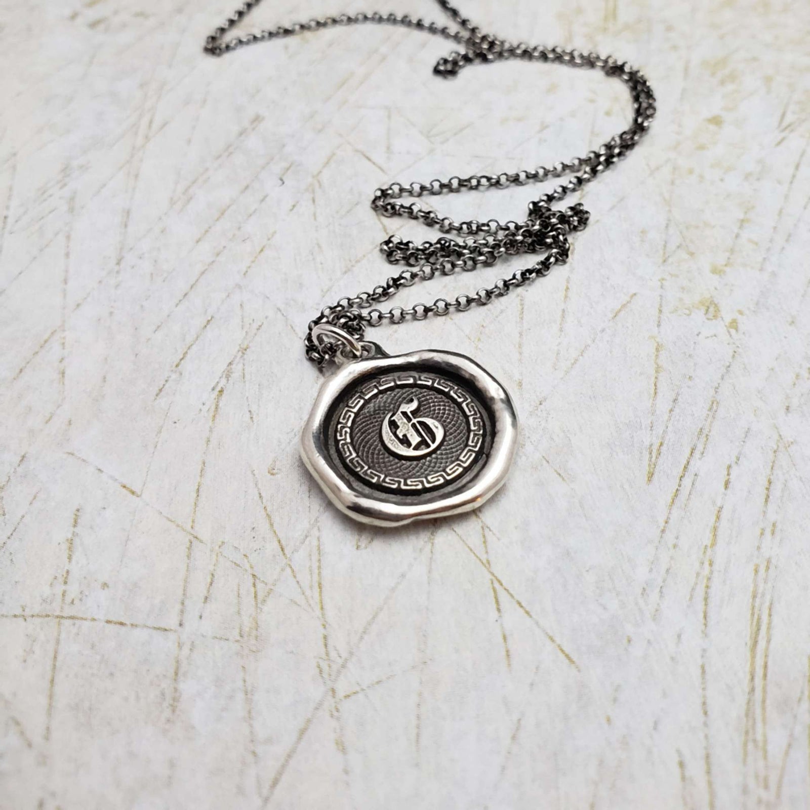 Initial G