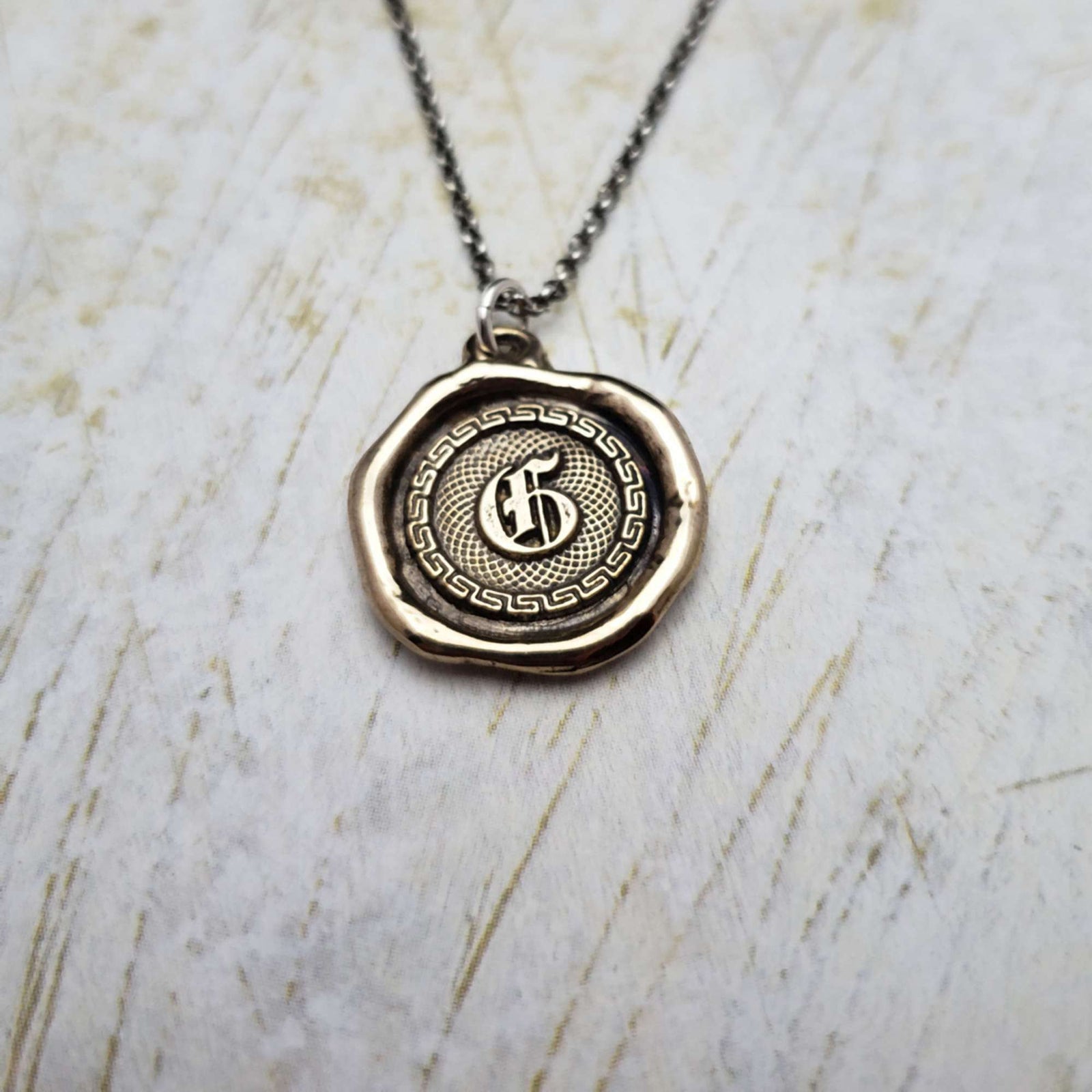 Letter G in Bronze