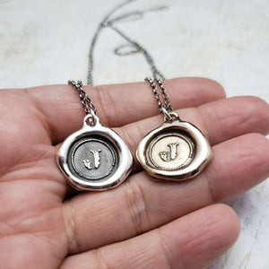 Initial J in Bronze