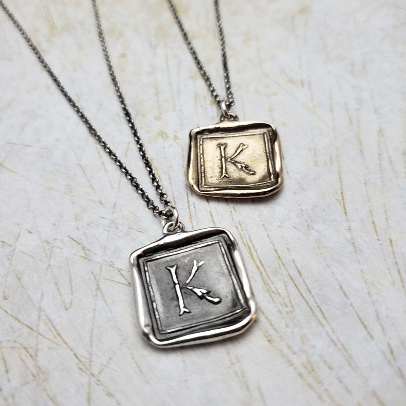 Initial K in Bronze