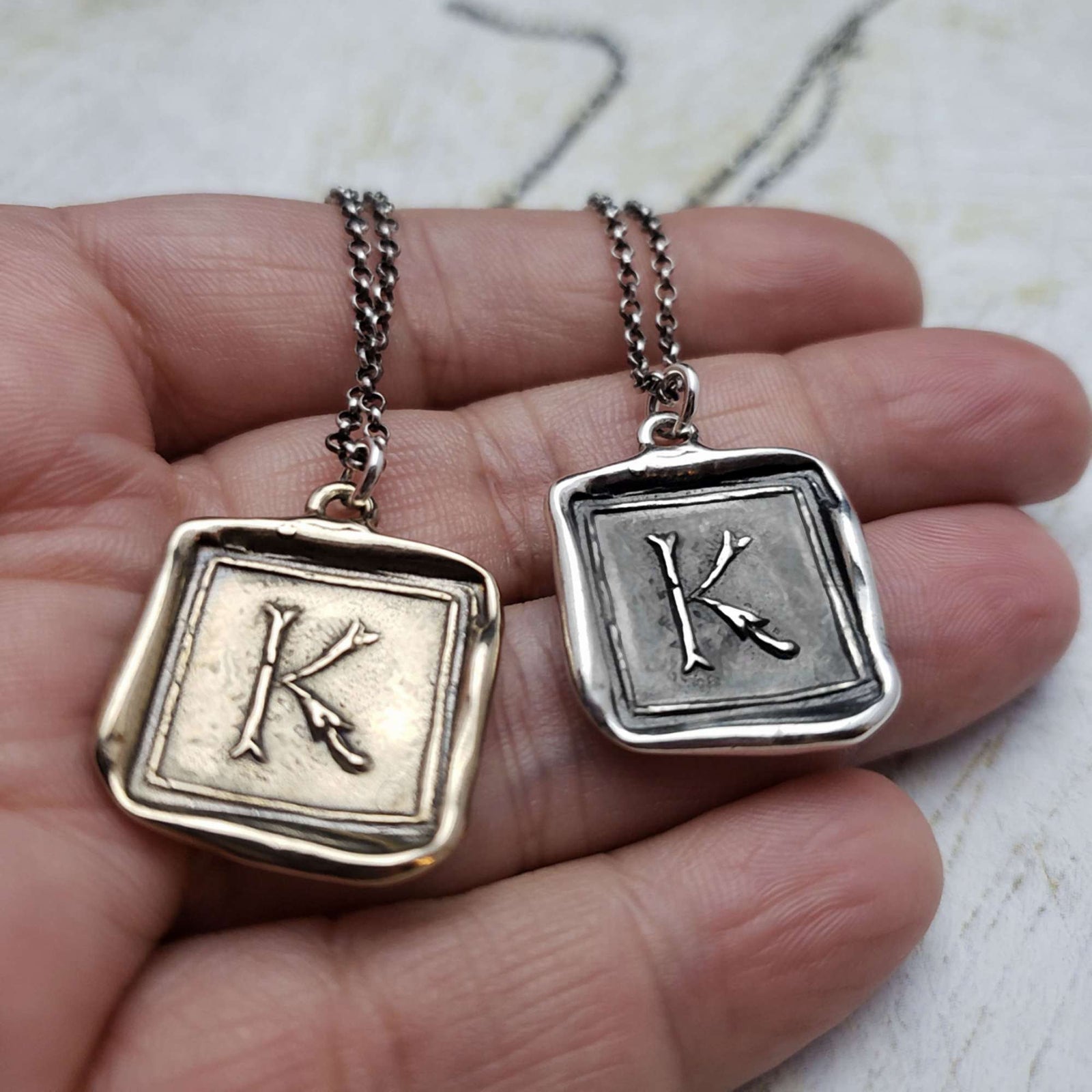 Initial K in Bronze