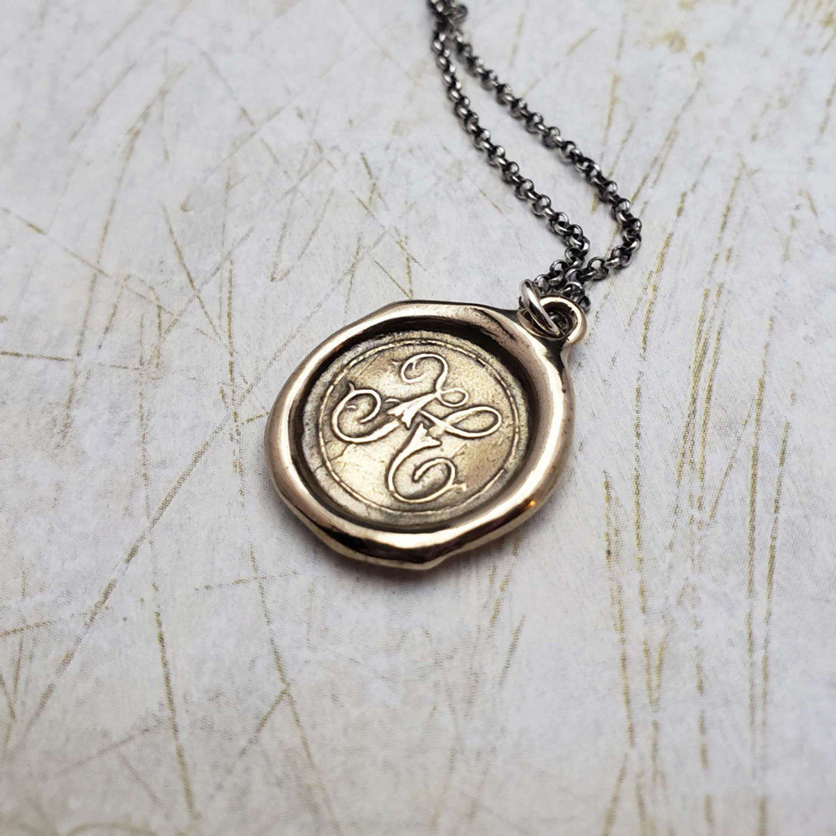 Initial H in Bronze