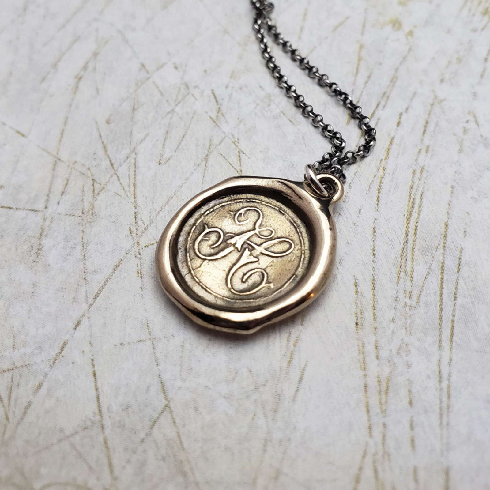 Initial H in Bronze