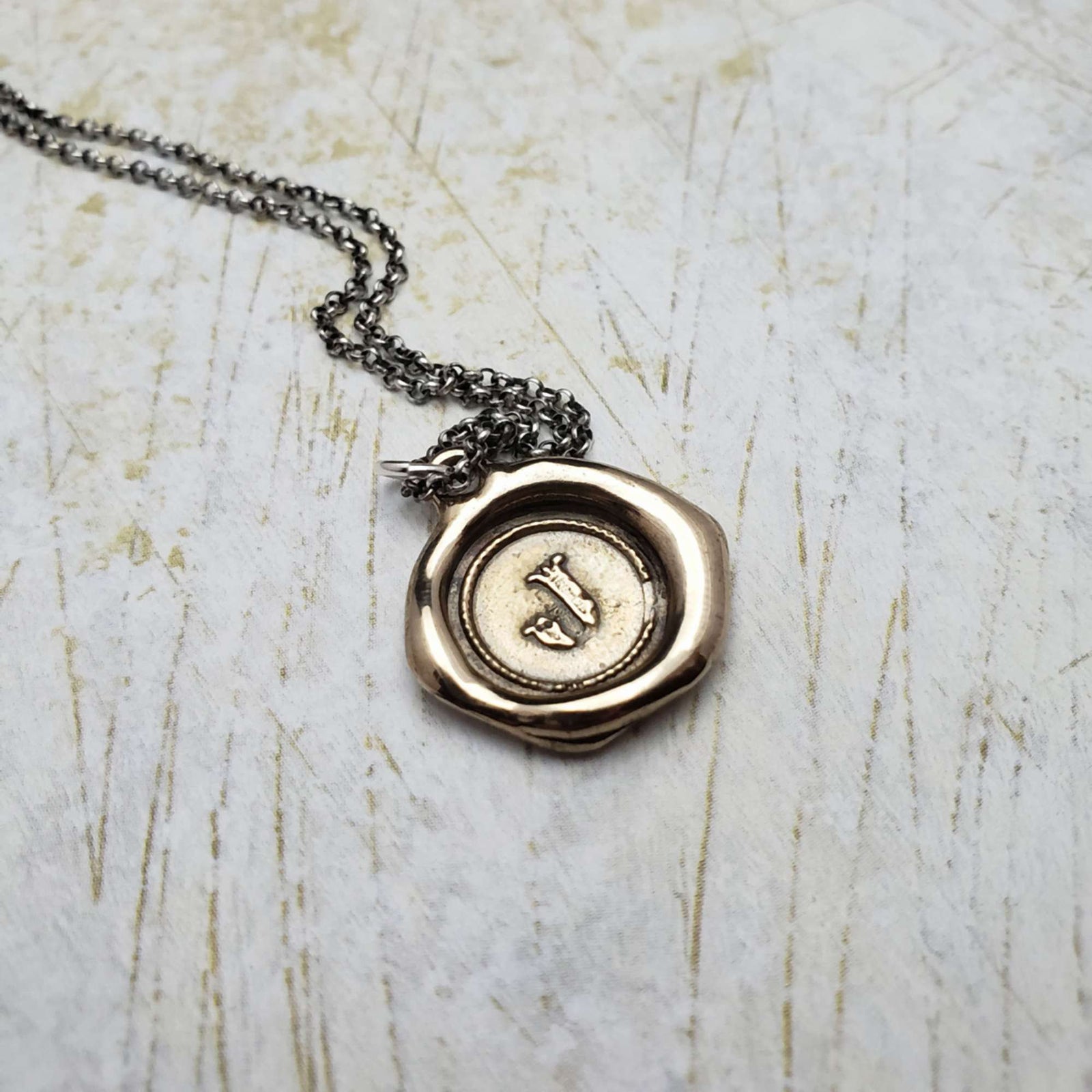 Initial J in Bronze