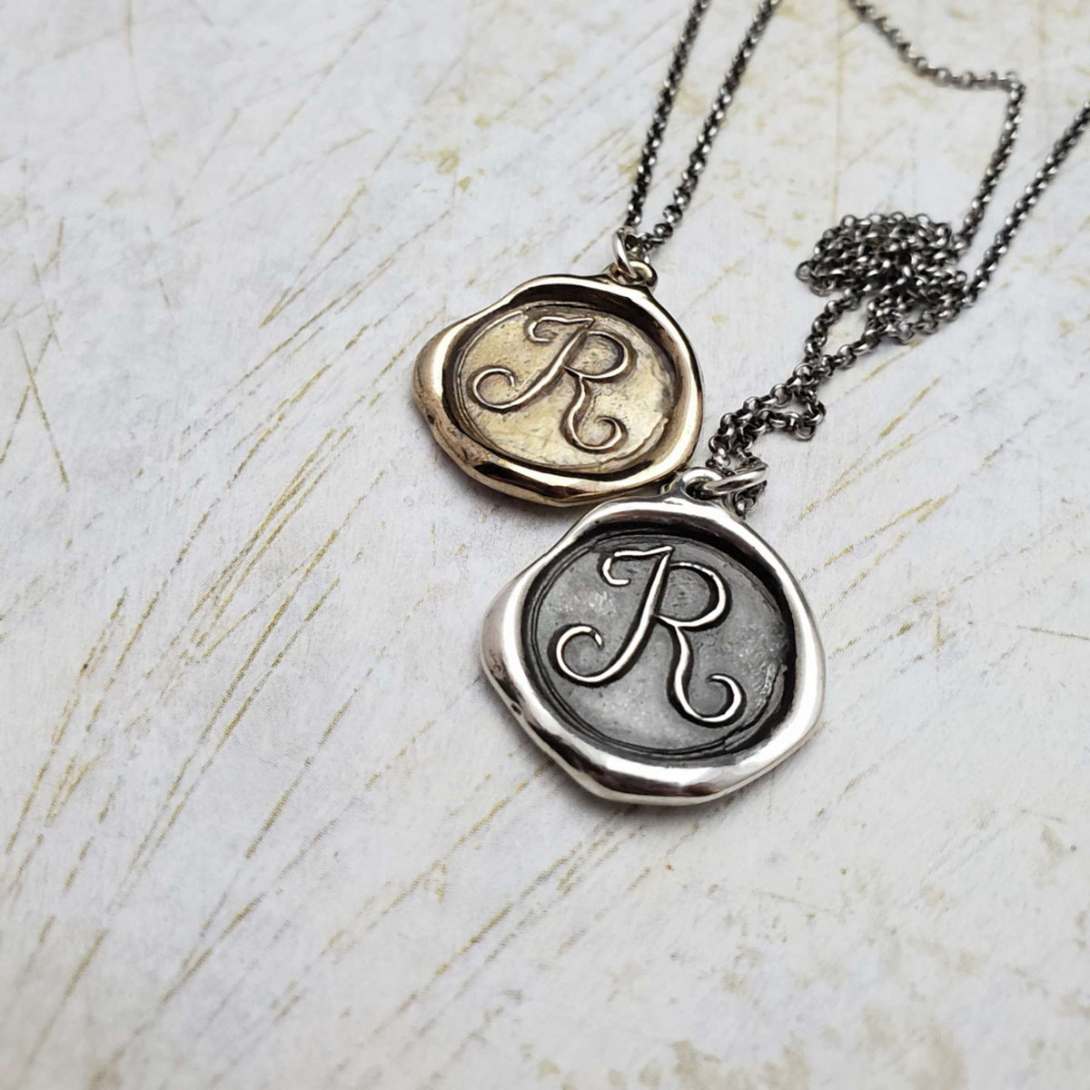 Initial R in Bronze
