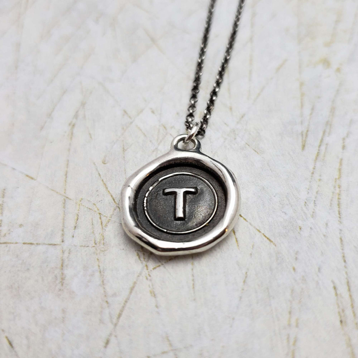Initial T